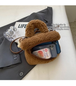 Internal view showing large capacity of the brown plush faux fur square bag for daily items
