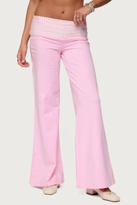 Detail view of pink and white checkered fold-over waistband on loose wide-leg pants