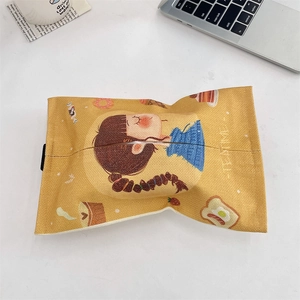 Close-up of yellow cotton-linen tissue bag featuring cute cartoon girl and dessert pattern