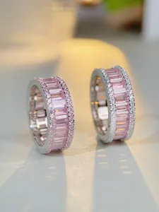 Macro shot of S925 sterling silver ring with pink step-cut stone and pavé diamonds