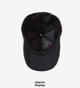 Interior view of baseball cap showing black fabric lining and reinforced cross stitching
