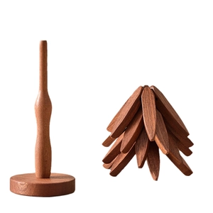 Solid wood tree-shaped placemat and coaster set in black walnut finish on white background