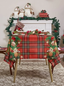 Detailed Christmas tablecloth with red plaid, gingerbread houses, and pine cones