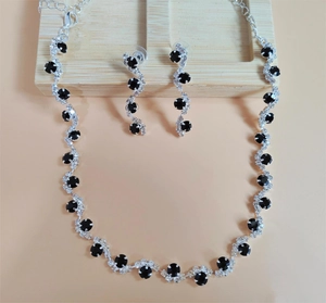 Macro view of bridal silver plated necklace and earrings with black stones and rhinestones
