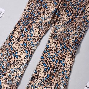 Close-up of blue leopard print stretchy flare pants showing fabric texture and detail