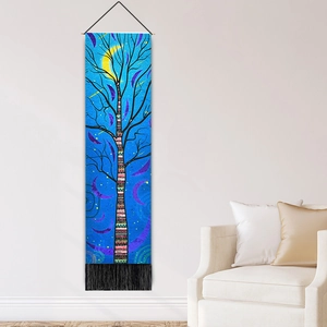 Nordic tree of life wall tapestry with blue night sky, moon, and black fringe accents