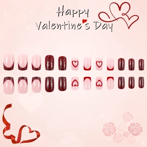 Short square press-on nails with red glitter and pink heart designs for Valentine's Day