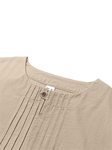 Detail of khaki linen shirt collar with natural texture and vintage buttons