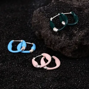 S925 silver colorful enamel hoop earrings in green, blue, and pink on volcanic rock