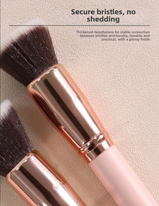 Detailed macro view of dense synthetic foundation brush bristles with a rose gold metal ferrule