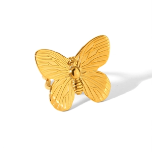 Detailed close-up of a gold butterfly ring featuring intricate metal textures and wing patterns