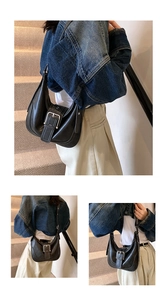 Detail view of black leather Hobo bag with silver metal buckle and adjustable shoulder strap