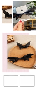 Detail of bat-shaped leather hair clips with metal duckbill clips and backcard packaging
