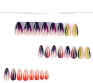 Detail of almond-shaped press-on nails featuring vibrant rainbow gradient color patterns