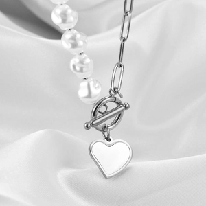Asymmetric pearl and silver clip chain necklace with a smooth heart pendant and OT clasp
