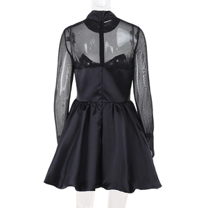 Detail of elegant black mesh and satin patchwork dress back with zipper closure