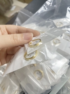 Detail view of gold-plated star and moon rings in size 7 and size 8 with small crystals