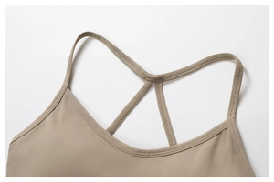 Detail of cross-back straps and fine stitching on khaki quick-dry sports bra