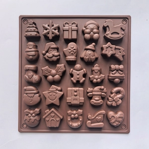 Detailed view of brown 25-cavity silicone mold featuring festive Christmas themed shapes