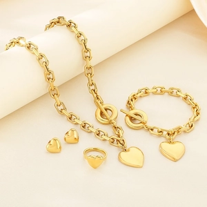 Golden stainless steel heart jewelry set with OT buckle necklace, bracelet, and earrings