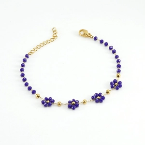 Elegant 18K gold-plated stainless steel bracelet featuring delicate purple crystal flowers