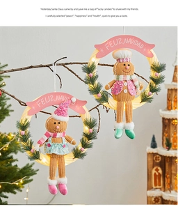 Macro detail of gingerbread man hanging wreath with glowing LED ring for Christmas