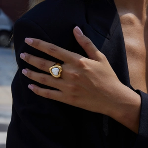 Detail shot of chunky 18K gold stainless steel heart ring with white mother of pearl inlay
