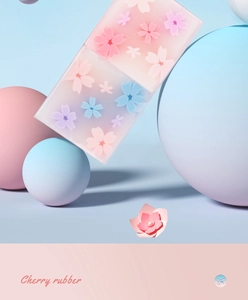 Détail de gommes dégradées rose et bleu avec motif fleur de cerisier et texture gel