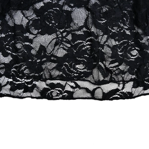 Close-up of black floral lace fabric detailing mesh structure on the summer long skirt
