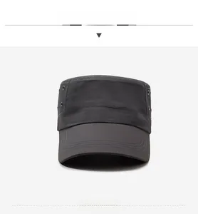 Front view of dark grey flat top cadet cap with metal eyelets and breathable fabric