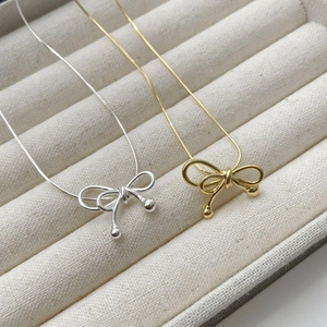 Elegant S925 silver bow pendant necklace with snake chain in gold and silver finishes