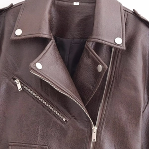 Deep brown faux leather jacket with lapel collar and metal zippers in a cropped biker style