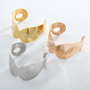 Three-piece stainless steel open cuff bracelets in gold, silver, and rose gold with crystals