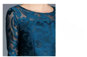 Detail of peacock blue lace dress featuring hollow mesh fabric and 3D floral embroidery
