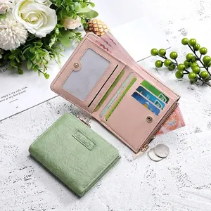 Short vintage fold wallet for women in soft pastel green and pink pebbled faux leather