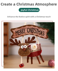 Detail of plush Christmas reindeer ornament with Merry Christmas sign and red bell