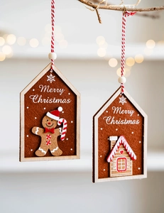 Felt gingerbread man and house inside wooden frames hanging as Christmas ornaments