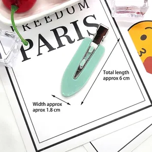 Detail showing 6cm mint green resin duckbill hair clip with silver metal crocodile grip