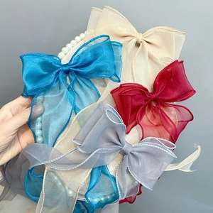 Double-layered organza bow hair clips in light blue, beige, grey, and red for women