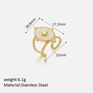 Detailed view of oval shell ring with gold octagonal star and dimension specifications