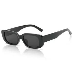 Retro small square frame sunglasses in glossy black with dark grey lenses for street style