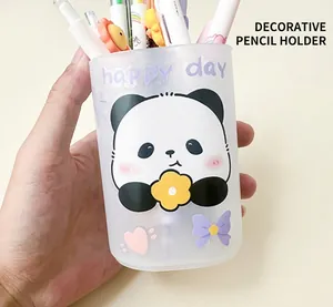 Close-up of a panda stationery pen holder with cute happy day decorative cartoon stickers
