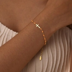Chic gold stainless steel chain bracelet with orange beads and a cross charm for women