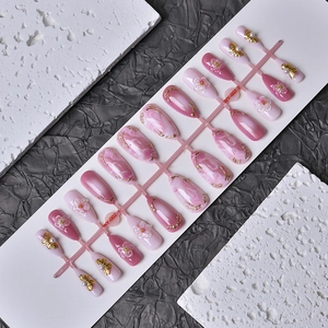 Almond press-on nails set with pink marble, 3D floral carving and golden butterfly motifs