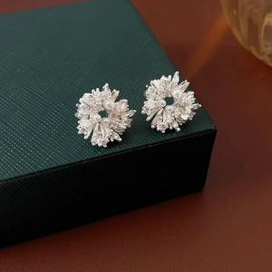 Asymmetric silver flower stud earrings with elegant pearls and sparkling zircons