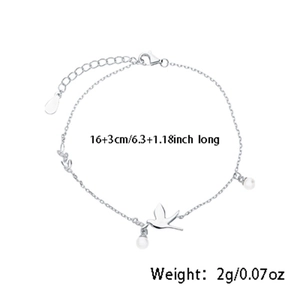 Detailed view of silver bird bracelet with length parameters 16+3cm and pearl accents