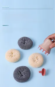 Macro shot of detachable kitchen scrub brush set showing fiber ball replacement