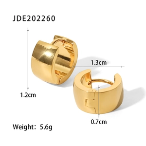 Macro view of wide 18K gold plated stainless steel huggie earrings with size details