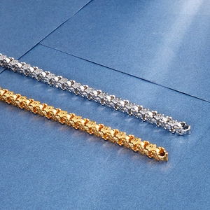Detailed close-up of 18K gold and silver plated titanium steel flower link bracelets
