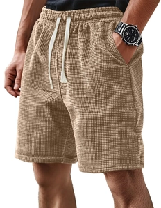 Close-up of khaki waffle textured fabric on men's casual shorts with drawstring waist